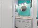 Bathroom with a vessel sink, modern vanity, and teal walls at 10263 Gandy N Blvd # 202, St Petersburg, FL 33702