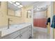 Updated bathroom with a modern vanity and a shower/tub combo at 10263 Gandy N Blvd # 202, St Petersburg, FL 33702
