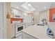 Updated kitchen featuring white appliances and granite countertops at 10263 Gandy N Blvd # 202, St Petersburg, FL 33702