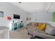 Bright living area featuring a sectional sofa and a media center at 10263 Gandy N Blvd # 202, St Petersburg, FL 33702