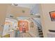 Open concept living area with high ceilings and stairs to loft at 10263 Gandy N Blvd # 202, St Petersburg, FL 33702