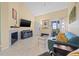 Living room with fireplace, balcony access, and comfy seating at 10263 Gandy N Blvd # 202, St Petersburg, FL 33702