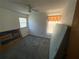 Bedroom with grey carpet and a window with curtains at 10296 Horizon Dr, Spring Hill, FL 34608