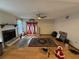 Living room with hardwood floors, fireplace, and access to the backyard at 10296 Horizon Dr, Spring Hill, FL 34608