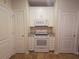 View of kitchen with white cabinets and granite countertops at 10426 Villa View Cir # 10426, Tampa, FL 33647