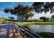 Walkway over water with lush landscaping and building in background at 11730 Shipwatch Dr # 504, Largo, FL 33774