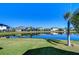 Waterfront property with lush green landscaping and homes at 11807 Cross Vine Dr, Riverview, FL 33579