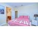 Bedroom with ensuite bathroom and a comfortable bed at 11807 Cross Vine Dr, Riverview, FL 33579