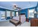 Main bedroom with a post bed, and access to balcony at 11807 Cross Vine Dr, Riverview, FL 33579