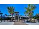 Community clubhouse with palm trees and brick pavers at 11807 Cross Vine Dr, Riverview, FL 33579