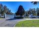 Gated community entrance with white fence and landscaping at 11807 Cross Vine Dr, Riverview, FL 33579