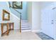 Bright and spacious entryway with staircase and wood floors at 11807 Cross Vine Dr, Riverview, FL 33579
