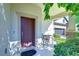 Inviting front porch with sitting area and landscaping at 11807 Cross Vine Dr, Riverview, FL 33579