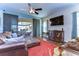 Relaxing Gathering room with leather couches and a large TV at 11807 Cross Vine Dr, Riverview, FL 33579