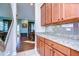 Kitchen with granite countertops and wood cabinets at 11807 Cross Vine Dr, Riverview, FL 33579