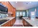 Modern kitchen with granite countertops and stainless steel appliances at 11807 Cross Vine Dr, Riverview, FL 33579