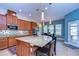 Gourmet kitchen features granite island and breakfast nook at 11807 Cross Vine Dr, Riverview, FL 33579