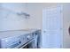 Laundry room with LG washer and dryer, and shelving at 11807 Cross Vine Dr, Riverview, FL 33579