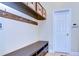 Laundry room with bench, hooks, and shelving at 11807 Cross Vine Dr, Riverview, FL 33579