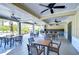Outdoor kitchen and dining area with ceiling fans at 11807 Cross Vine Dr, Riverview, FL 33579