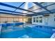 Large pool and spa with covered patio and grilling area at 11807 Cross Vine Dr, Riverview, FL 33579