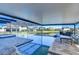 Resort-style pool and spa with covered patio and lake views at 11807 Cross Vine Dr, Riverview, FL 33579