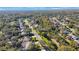 Wide aerial view of neighborhood homes and landscape at 16124 Vanderbilt Dr, Odessa, FL 33556