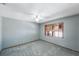 Bright bedroom with ceiling fan and window shutters at 16124 Vanderbilt Dr, Odessa, FL 33556