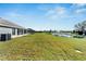 Backyard with pond view and green grass at 16207 59Th E Ct, Parrish, FL 34219