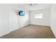 Bedroom with carpet floors, ceiling fan, and a window at 1847 Shore S Dr # 509, South Pasadena, FL 33707