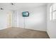 Bedroom with carpet floors, ceiling fan, and a window at 1847 Shore S Dr # 509, South Pasadena, FL 33707