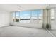 Bright bedroom with large windows offering a beautiful waterfront view, ceiling fan and mirrored closet at 1847 Shore S Dr # 509, South Pasadena, FL 33707