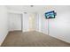 Bedroom with carpet, ceiling fan, and access to bathroom at 1847 Shore S Dr # 509, South Pasadena, FL 33707