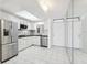 Bright condo kitchen with stainless steel appliances and white cabinets at 1847 Shore S Dr # 509, South Pasadena, FL 33707