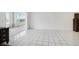 Open living room with tile floors, and mirrored wall at 1847 Shore S Dr # 509, South Pasadena, FL 33707