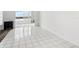 Bright living room with tile floors, and water view at 1847 Shore S Dr # 509, South Pasadena, FL 33707