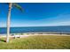 Scenic waterfront view with palm trees and bench at 19029 Us Highway 19 N # 32F, Clearwater, FL 33764