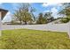 Fenced backyard with grassy lawn at 200 W Kirby St, Tampa, FL 33604