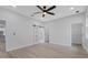 Bright bedroom with hardwood floors, ceiling fan, and barn door to bathroom at 200 W Kirby St, Tampa, FL 33604