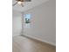 Bright bedroom with wood-look floors and ceiling fan at 200 W Kirby St, Tampa, FL 33604