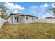 Back exterior view of house with fenced yard at 200 W Kirby St, Tampa, FL 33604