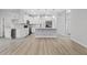 Modern kitchen featuring white cabinets, a large island, and stainless steel appliances at 200 W Kirby St, Tampa, FL 33604