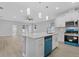 Open concept kitchen with island, stainless steel appliances, and pendant lighting at 200 W Kirby St, Tampa, FL 33604