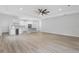Open-concept kitchen and living area with hardwood floors and island at 200 W Kirby St, Tampa, FL 33604