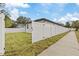 Side yard with fence and concrete walkway at 200 W Kirby St, Tampa, FL 33604