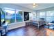 Bedroom with metal bed frame and large windows overlooking backyard at 2175 Nottingham Dr, Clearwater, FL 33764