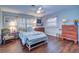 Cozy bedroom with double bed, wood floors, and ample closet space at 2175 Nottingham Dr, Clearwater, FL 33764