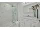 Updated bathroom featuring marble shower and vanity at 2372 Millwood Ln, Clearwater, FL 33763