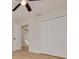 Bedroom with light walls, ceiling fan, and ample closet space at 2372 Millwood Ln, Clearwater, FL 33763