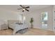 Spacious bedroom with light flooring, ceiling fan, and access to the pool at 2372 Millwood Ln, Clearwater, FL 33763